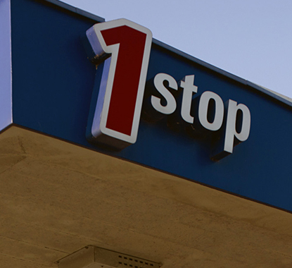 Signage on a service-station bulkhead reading "1 stop".