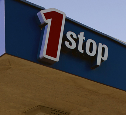 Engen 1 stop mobile Signage on a service-station bulkhead reading "1 stop".